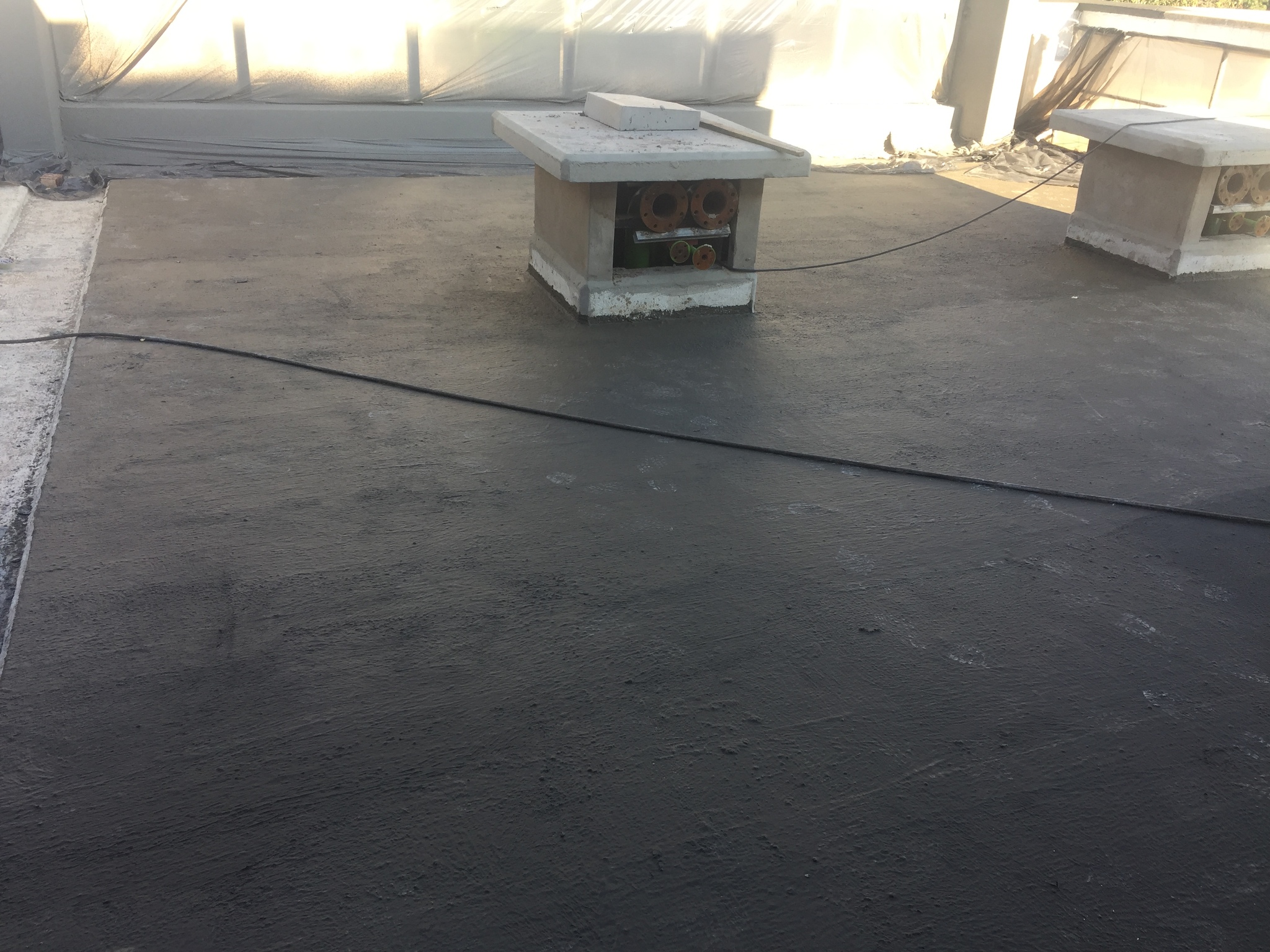 Flat roof surface and roof penetrations